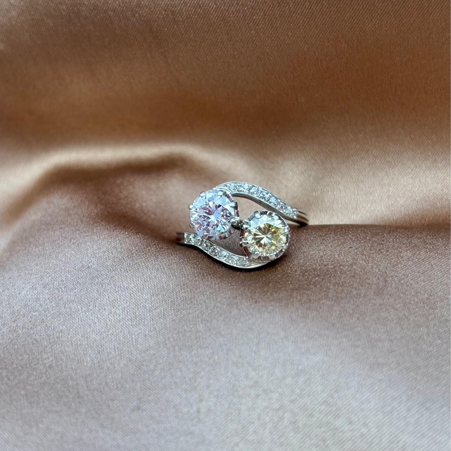 Diamond ring on a beige fabric background